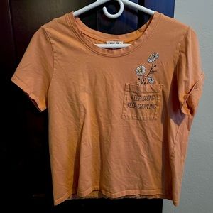Orange "keep going keep growing" tee